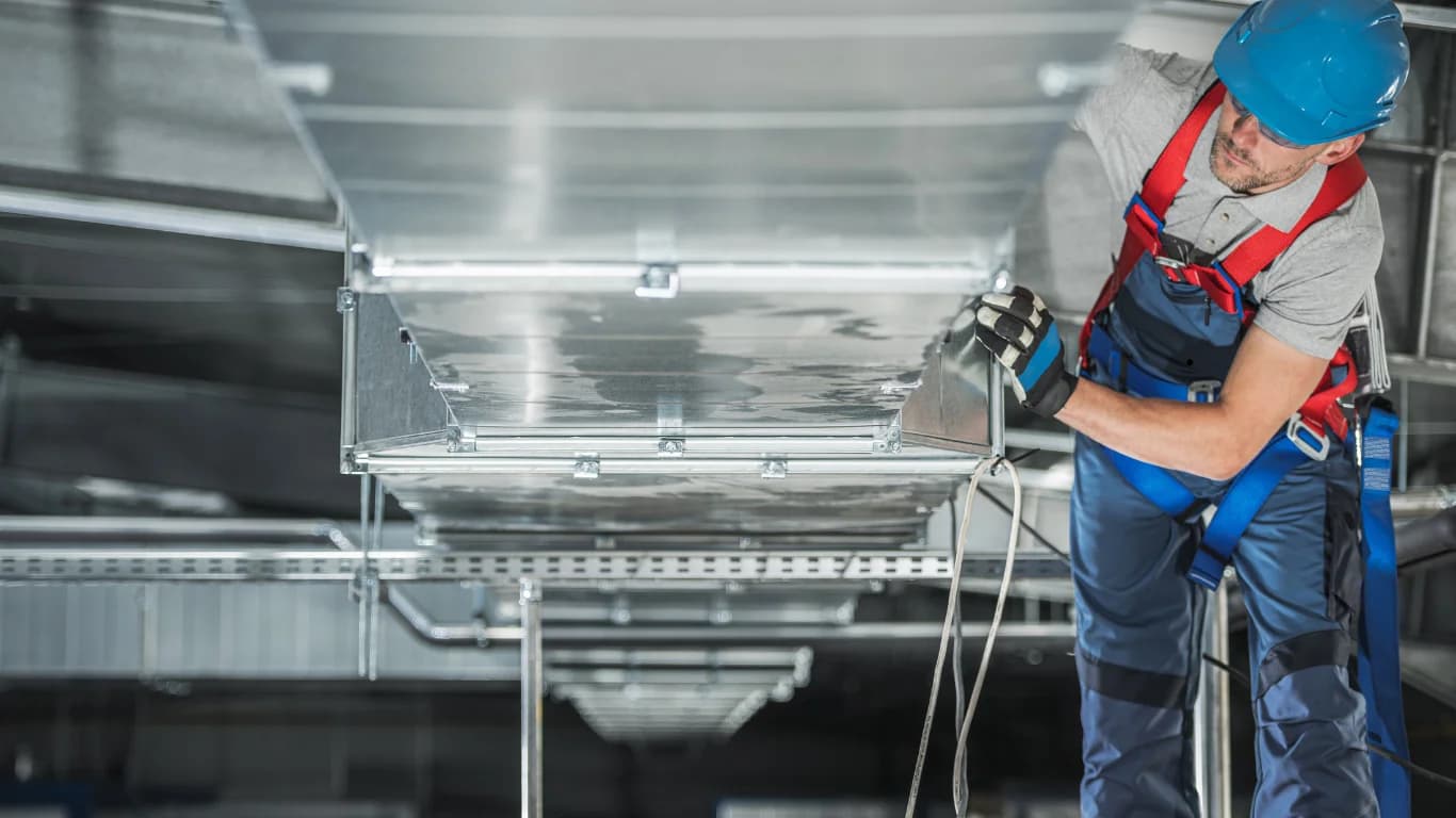 Commercial insulation installation in warehouse